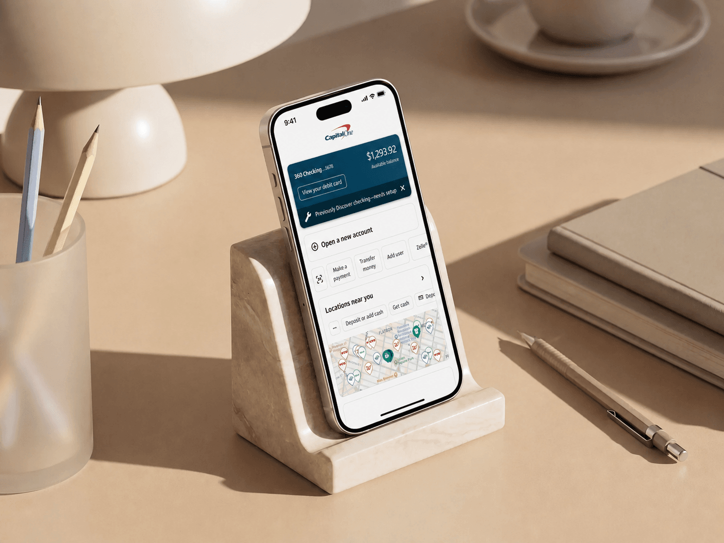 Discover Integration: iPhone mockup showing the migrated Capital One account experience